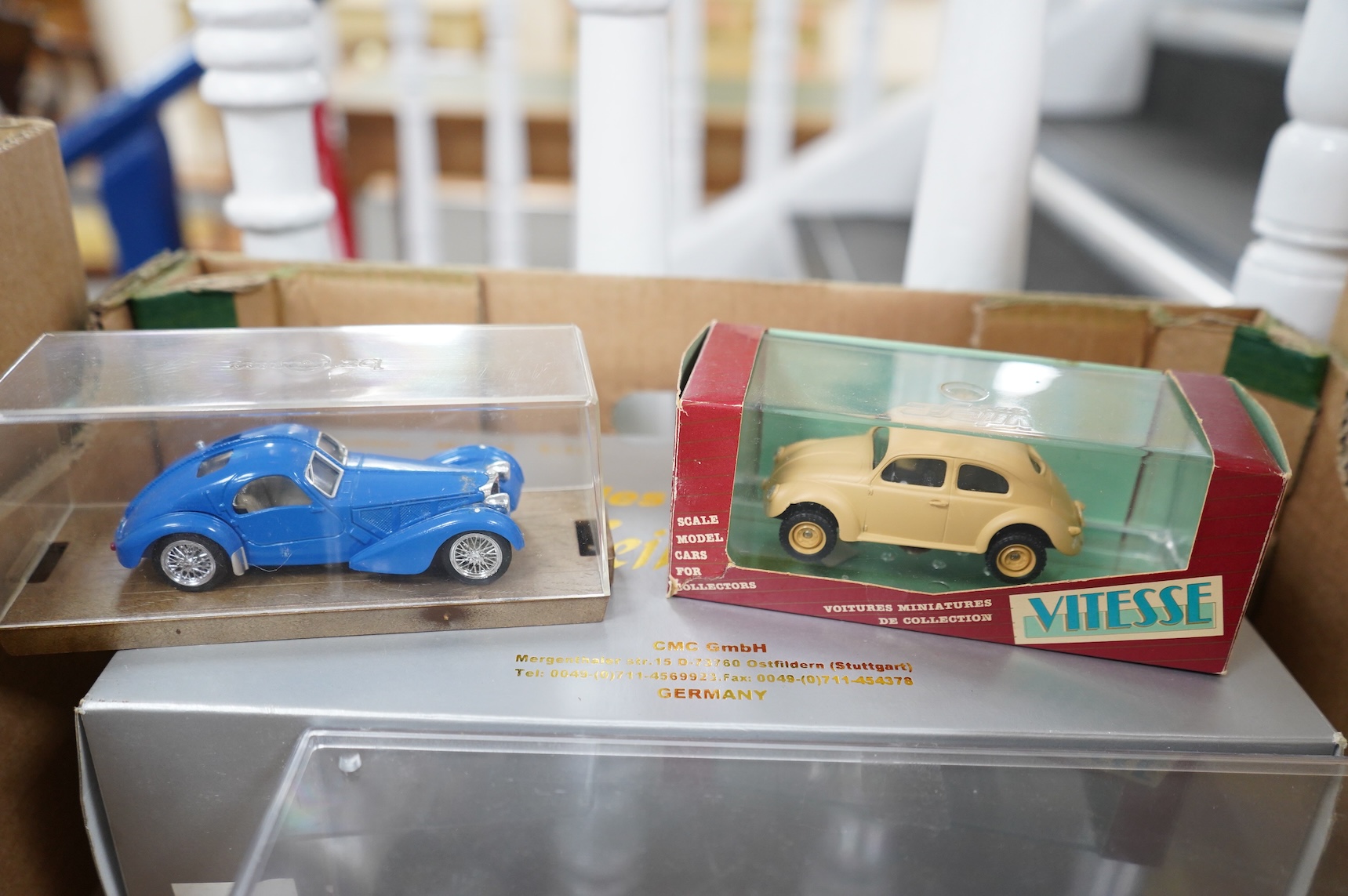 A collection of diecast vehicles, including a boxed CMC 1:18 scale Mercedes Benz W196 1950s single seat racing car, together with five boxed early Matchbox Models of Yesteryear, two Atlas Dinkies, a 1:18 scale Bburago Bu